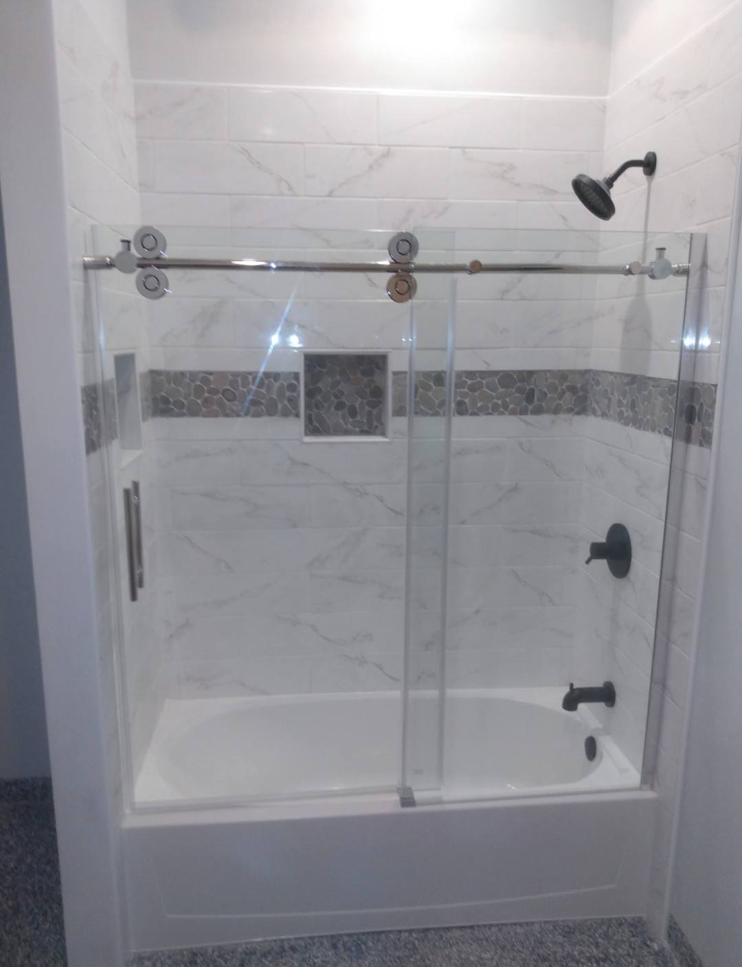 Marble tub-shower combo with glass door
