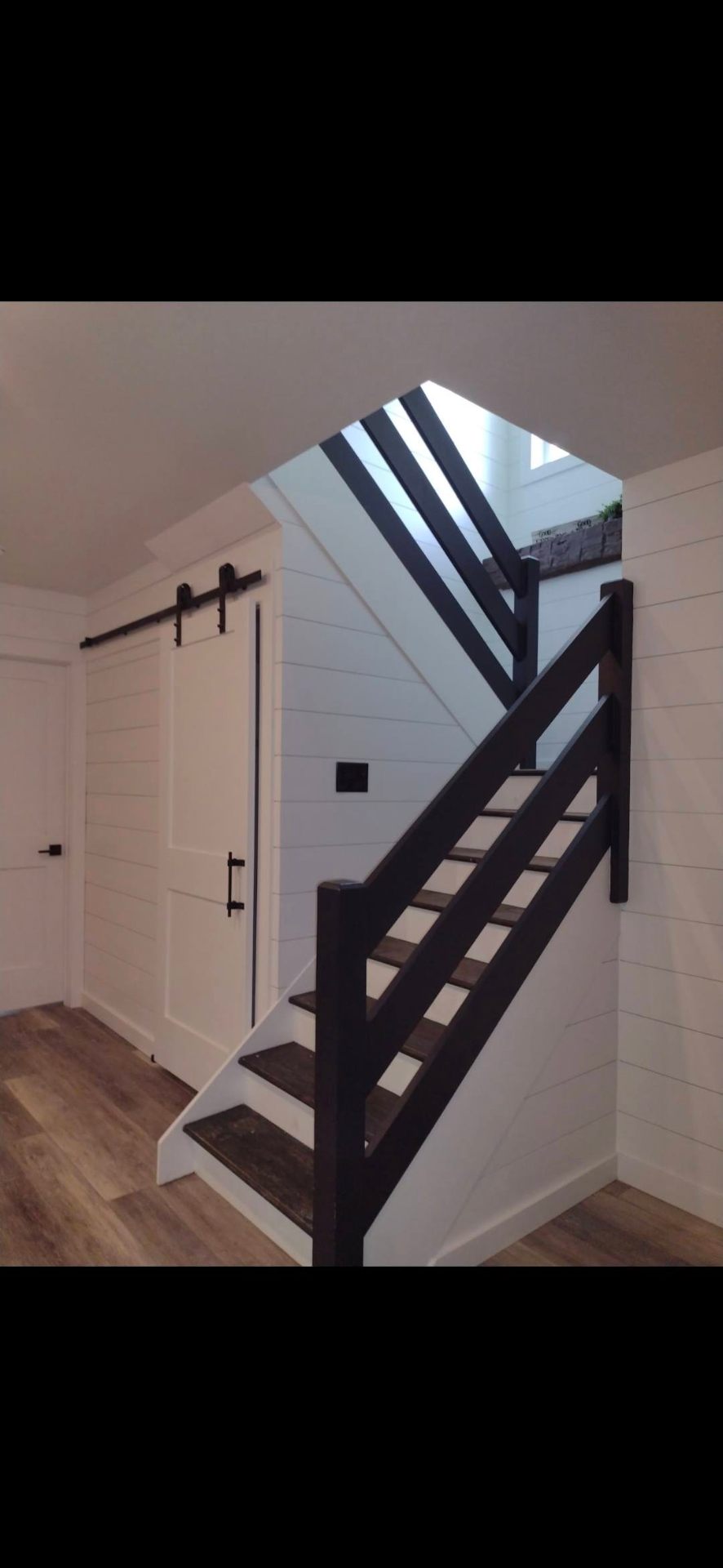 Custom staircase with barn door