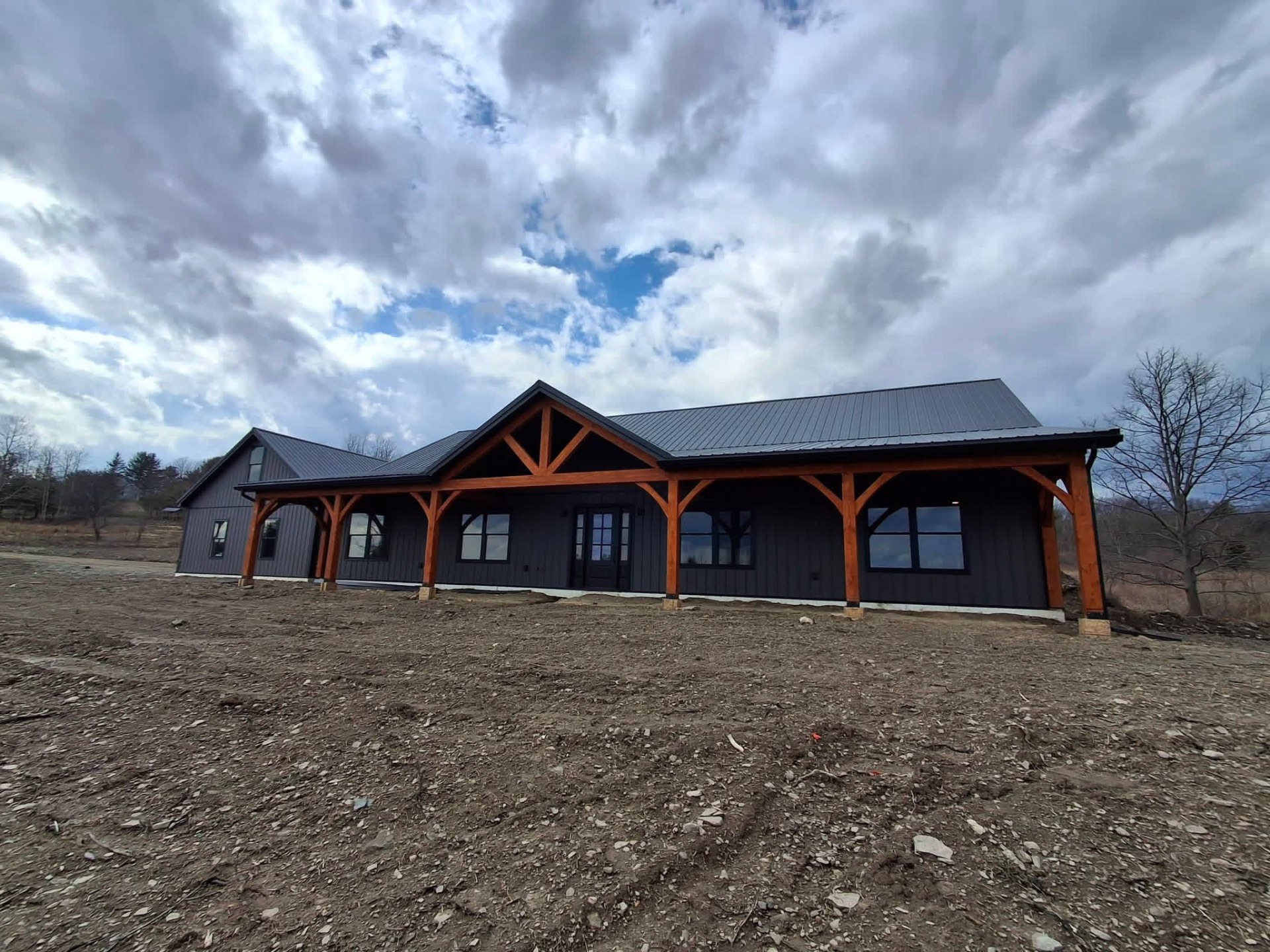 Custom timber frame home with wraparound porch